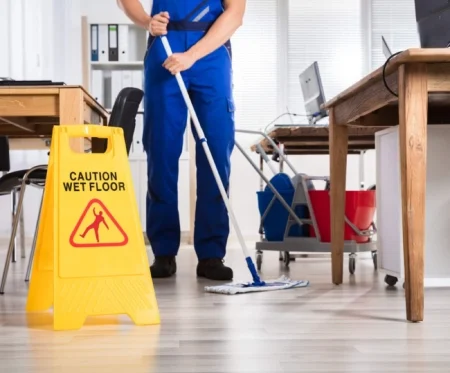 Detail-oriented dusting and sanitization of a corporate boardroom table and chairs.
